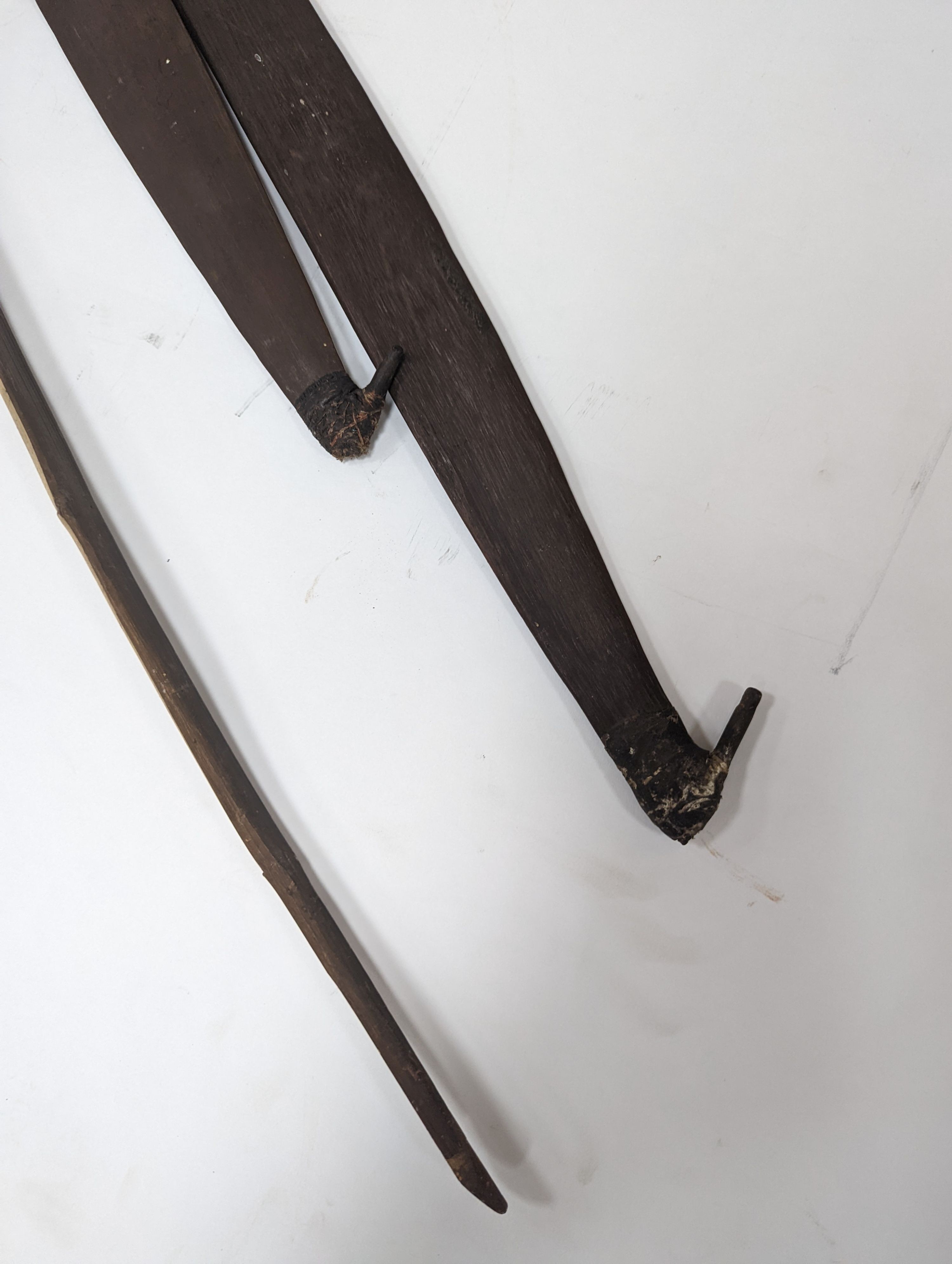Two chip-carved paddle blades and bow, possibly Fijian.